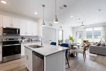 Gourmet kitchens with granite countertops & convenient islands